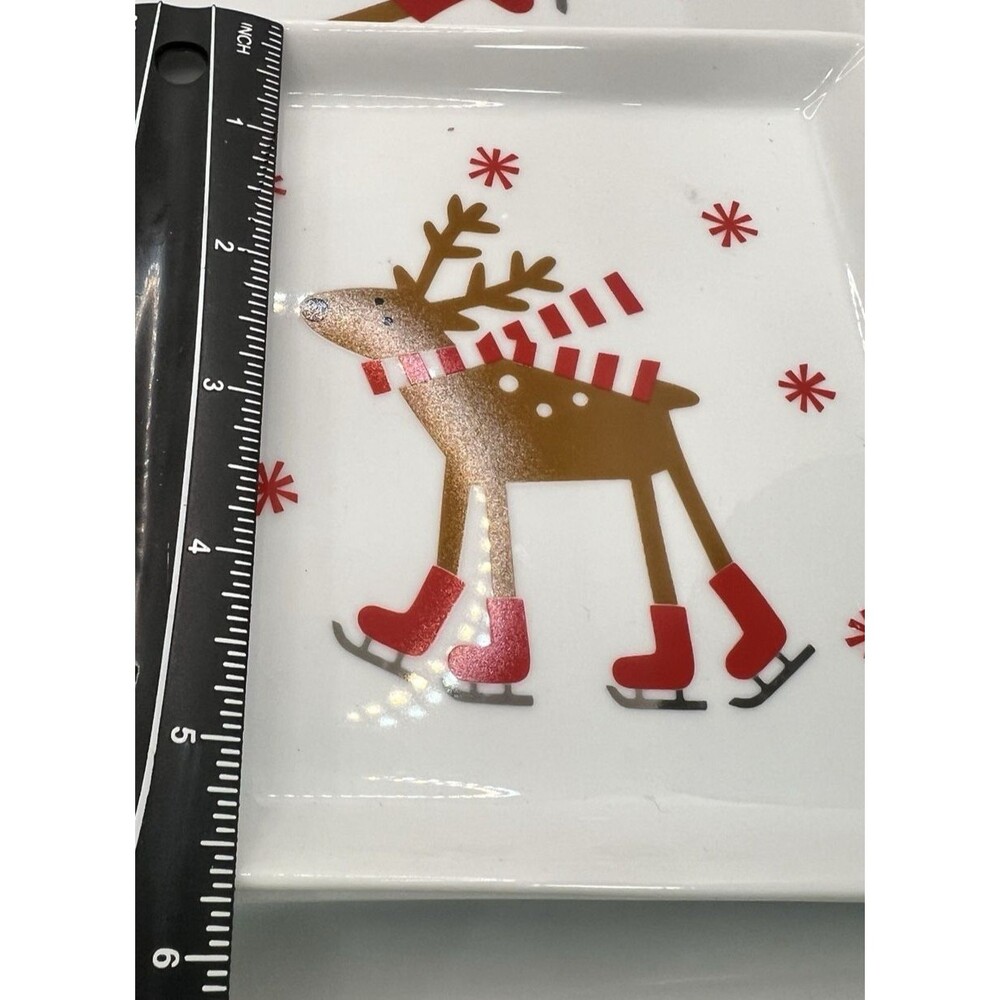 CRATE & BARREL SKATING REINDEER CHRISTMAS 4 plates christmas